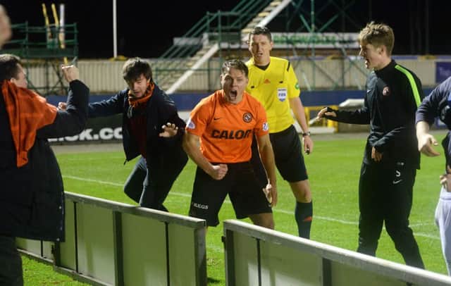 Dundee Utd's John Rankin celebrates after his side go 2-1 ahead. Picture: SNS