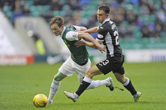 Liam Henderson and Jordan Marshall challenge for the ball. Picture: TSPL