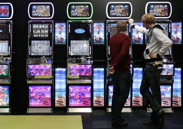 Fixed odds betting terminals have spread across Scotlands high streets, sparking concern from MSPs. Picture: AFP/Getty