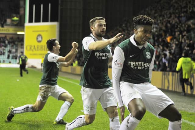 Dominique Malonga celebrates after scoring in stoppage time to secure Hibs' 1-0 win over Queen of the South. Picture: Neil Hanna