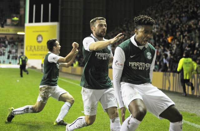 Dominique Malonga celebrates after scoring in stoppage time to secure Hibs' 1-0 win over Queen of the South. Picture: Neil Hanna