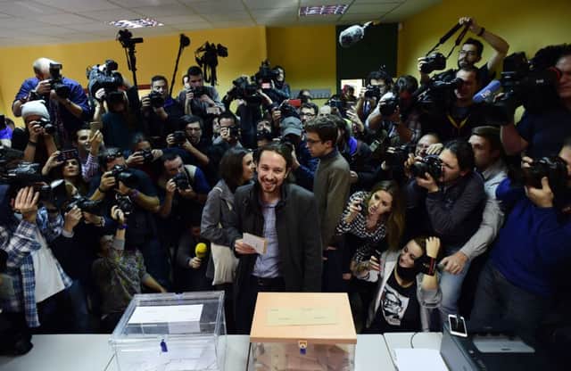 The leader of the anti-austerity Podemos (We can) party Pablo Iglesias waits to cast his vote. Picture: AFP/Getty
