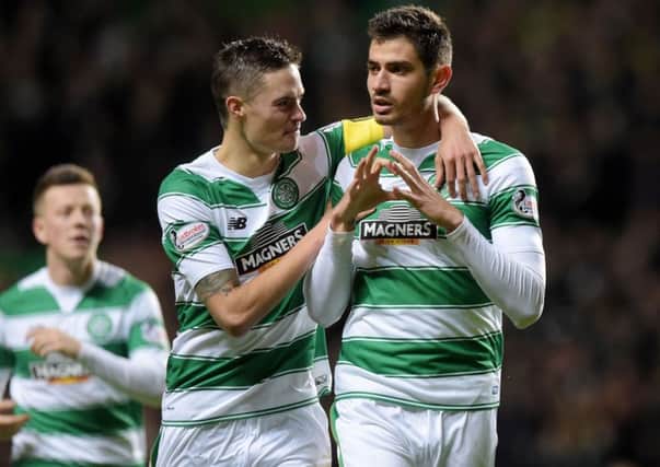 Celtic's Nir Bitton, right, celebrates with Mikael Lustig after opening the scoring against Motherwell. Picture: SNS