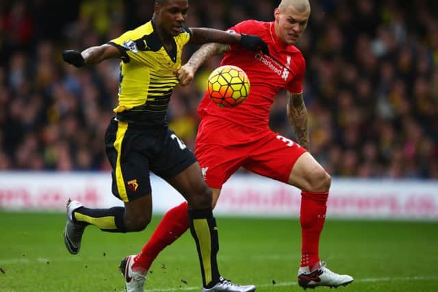 Odion Ighalo holds off Martin Skrtel of Liverpool as he scores Watford's second goal. Picture: Getty.