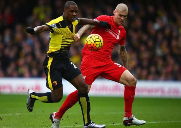 Odion Ighalo holds off Martin Skrtel of Liverpool as he scores Watford's second goal. Picture: Getty.
