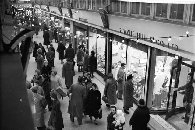 December 1959: Shoppers outside R Wylie Hill and Co Ltd in Glasgow's Argyll Arcade