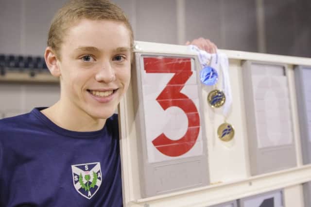 Joel McFarlane with his gold medals from the age-group Indoor Championships. Picture: Bobby Gavin