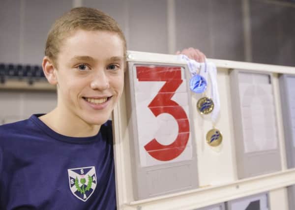 Joel McFarlane with his gold medals from the age-group Indoor Championships. Picture: Bobby Gavin