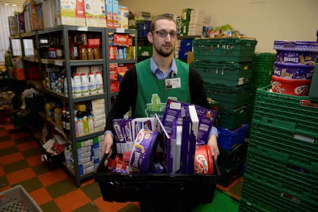 Glasgow Northwest Foodbank Christmas Appeal launch.
Manager Kyle McCormick with some of the donations. Picture: Nick Ponty