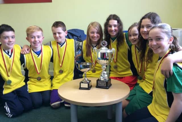 Hilton Primary Schol Under-12s with their cups and medals