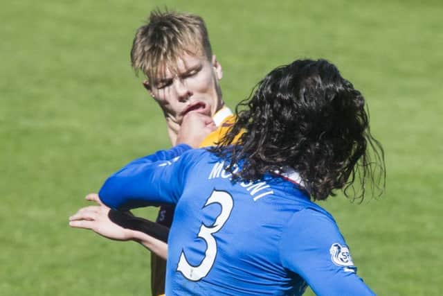 Bilel Mohsni and Lee Erwin clash at the end of the Premiership play-off final. Picture: Getty