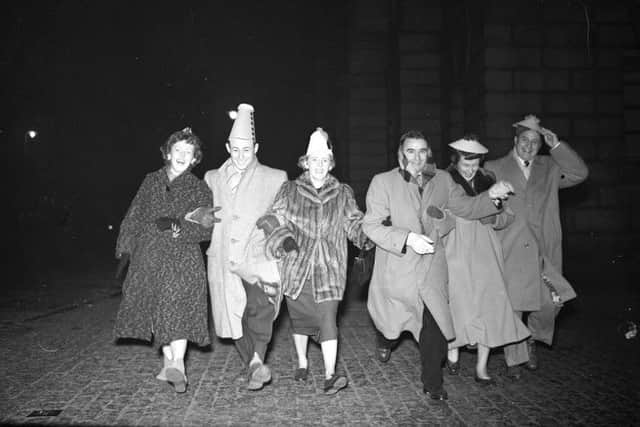 Hogmanay 1955: Six American tourists dance down the High Street. Picture: TSPL