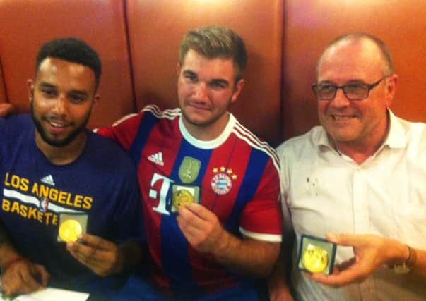 Anthony Sadler, Alek Skarlatos and British national Chris Norman with their medals after foiling a terrorist attack in France. Picture: Getty