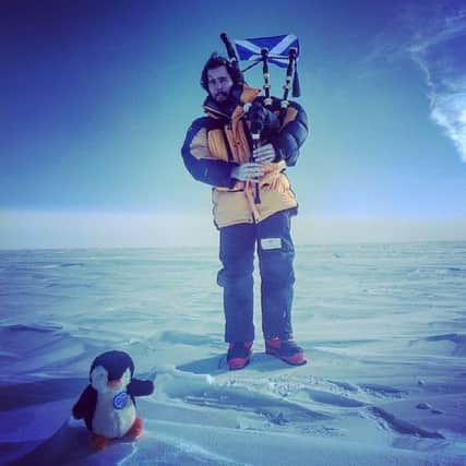 Jak Kennedy  has become the first man to play the bagpipes at the South Pole. Picture: Collect