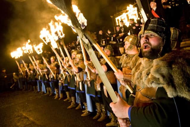 A torchlight procession along Princes Street and up Calton Hill is typically part of Edinburgh's Hogmanay celebrations. Image: Ian Georgeson