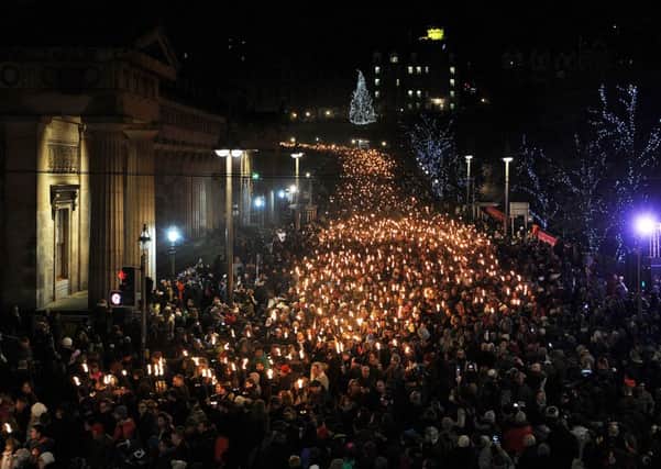 An estimated 8000 torchbearers, led by the Up Helly Aa Vikings from Shetland and more than 100 pipers, illuminated Edinburgh from George IV Bridge to Calton Hill during last year's Hogmanay celebrations.   Image: Neil Hanna