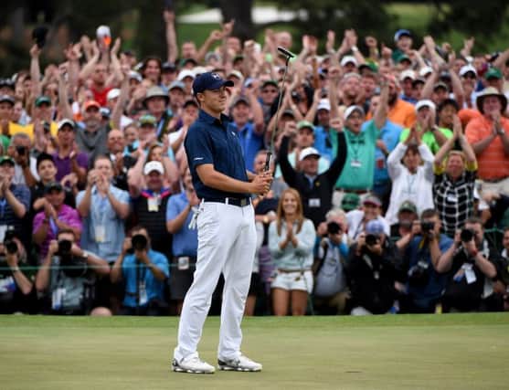 Jordan Spieth celebrates on the 18th green after winning the 2015 Masters at Augusta. Picture: Getty