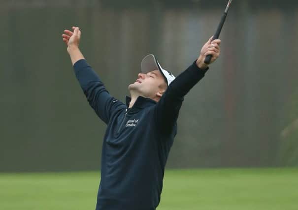 Russell Knox looks to the heavens after his WGC victory. Picture: Andrew Redington/Getty