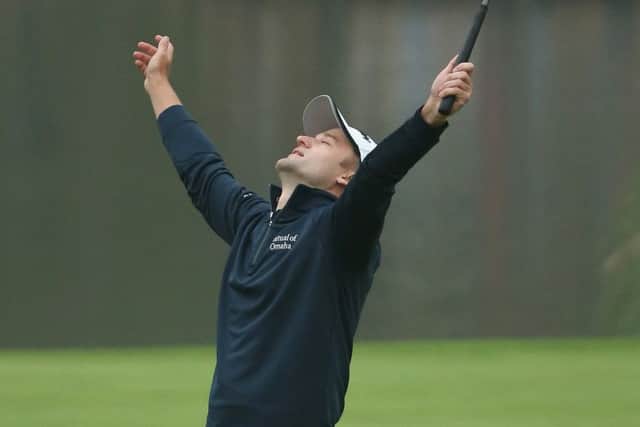 Russell Knox looks to the heavens after his WGC victory. Picture: Andrew Redington/Getty