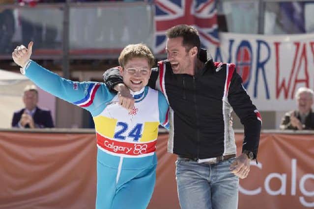 Eddie the Eagle, starring Hugh Jackman and Taron Egerton, tells the story of Britain's Eddie Edwards, who found brief fame as an enthusiastic amateur competitor at the 1988 Calgary Winter Olympics. Image: Collider