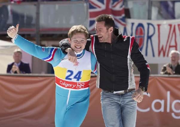 Eddie the Eagle, starring Hugh Jackman and Taron Egerton, tells the story of Britain's Eddie Edwards, who found brief fame as an enthusiastic amateur competitor at the 1988 Calgary Winter Olympics. Image: Collider