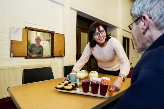 Project manager Frances Sutherland serves food during a drop-in day at the Destiny Angels centre in Glasgow. Picture: Frances Sutherland