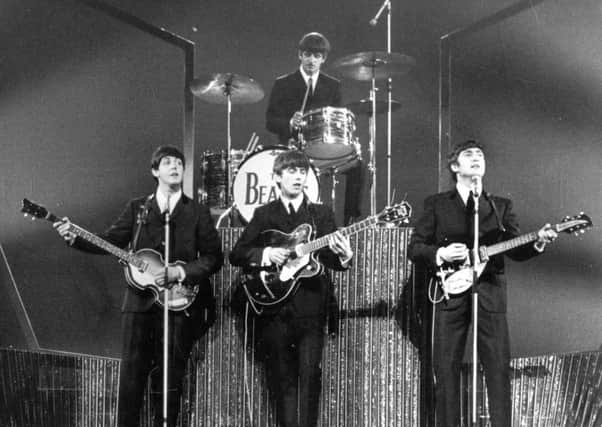 The Beatles on stage at the London Palladium during a performance in front of 2, 000 screaming fans. Picture: Getty