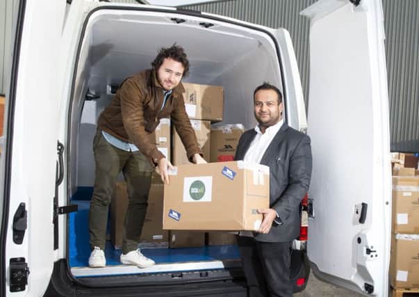 On Boxing Day a fleet of Social Bite vans will be travelling across Europe getting the gear to refugees. Josh Littlejohn (left) and Trespass owner Usman Khushi will be there.