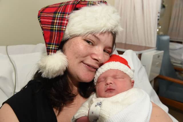 The first baby born on Christmas Day at St Johns Hospital was Ryan Andrew Clark, pictured here with mum Sarah. Picture: JP