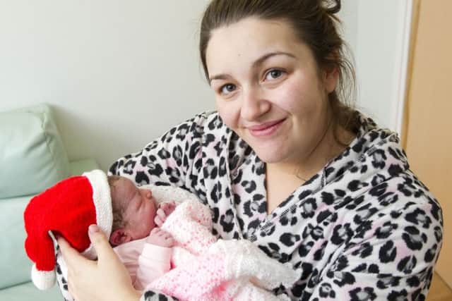 The first baby born on Christmas Day at the Royal Infirmary of Edinburgh was Hollie Archibald, held by her mother Stacey. Picture: Ian Rutherford