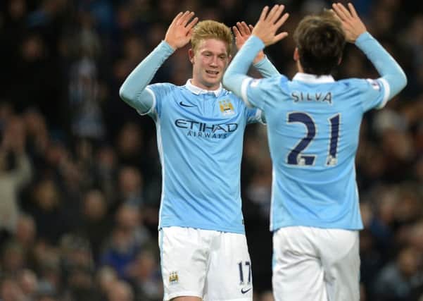 David Silva congratulates Kevin De Bruyne after the Belgian midfielder scored City's fourth. Picture: Getty Images