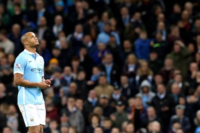 Vincent Kompany's face says it all as he lasts just nine minutes on his comeback from injury. Picture: PA