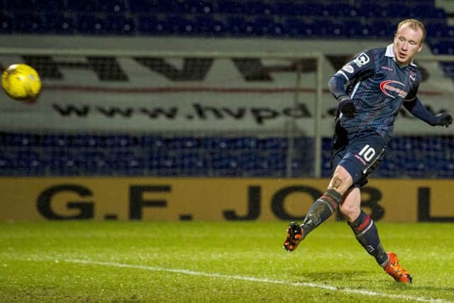 Liam Boyce sweeps the ball home for his third goal against Dundee. Picture: SNS Group