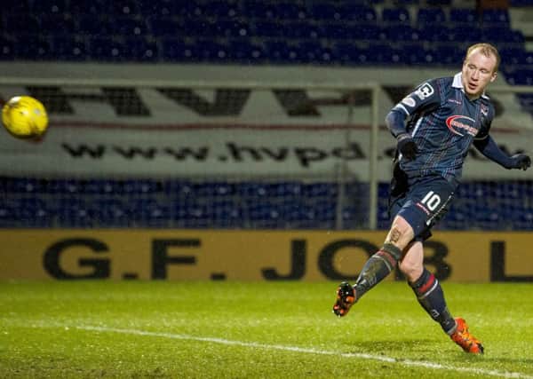 Liam Boyce sweeps the ball home for his third goal against Dundee. Picture: SNS Group