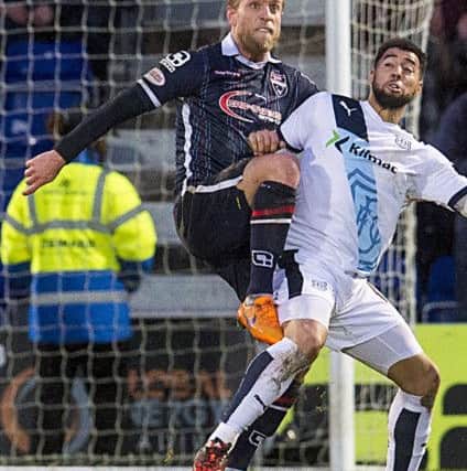 Kane Hemmings, seen here battling against County's Andrew Davies, twice put Dundee in front. Picture: SNS Group
