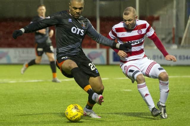 Grant Gillespie keeps a close eye on Kilmarnock forward Josh Magennis. Picture: SNS Group
