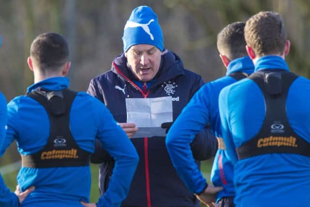 Warburton goes through the plan of action with his players. Picture: SNS