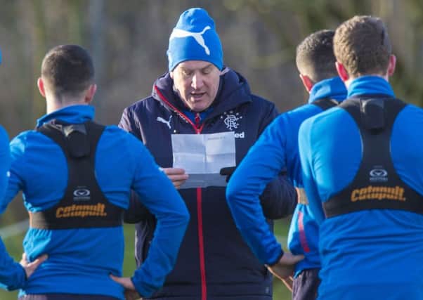 Warburton goes through the plan of action with his players. Picture: SNS