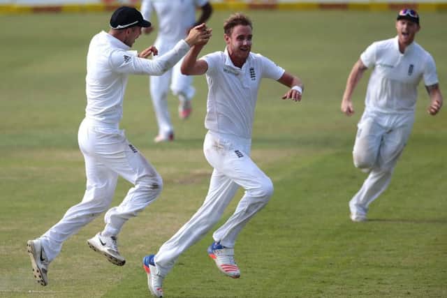 England bowler Stuart Broad, centre, celebrates after dismissing South African batsman AB de Villiers for 49 on day two in Durban. Picture: Getty