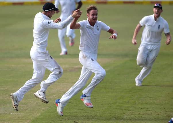 England bowler Stuart Broad, centre, celebrates after dismissing South African batsman AB de Villiers for 49 on day two in Durban. Picture: Getty