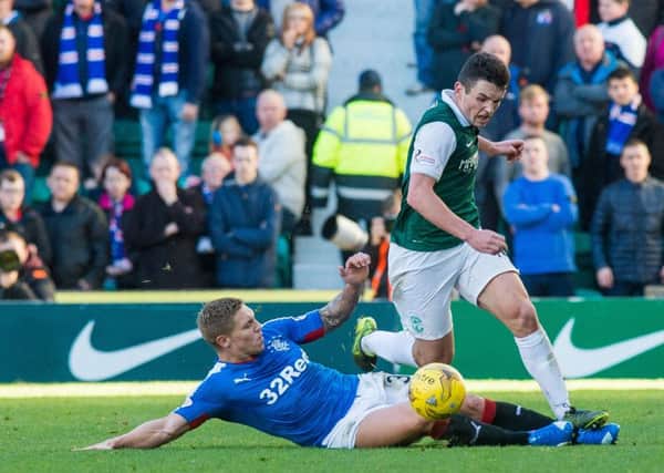 Martyn Waghorn attempts to stop John McGinn in the last meeting between Hibs and Rangers. Picture: Ian Georgeson