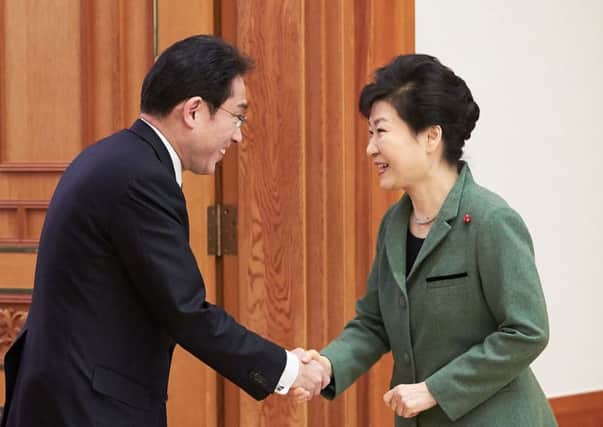 Park Geun-Hye, right, with Japanese minister Fumio Kishida. Picture: Getty Images