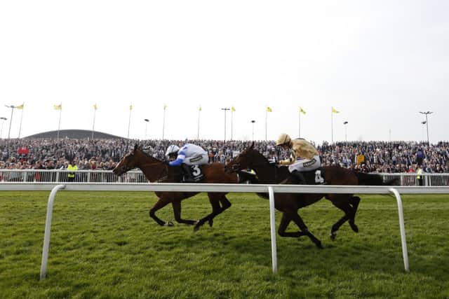 Barters Hill, ridden by David Bass, left, comfortably wins the Grade 2  bumper at Aintree last season from Bellshill. Picture: Getty