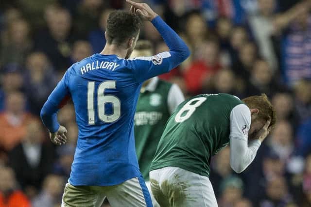 Rangers midfielder Andy Halliday was shown a red card after this incident with Hibs' Fraser Fyvie. Picture: Alan Rennie