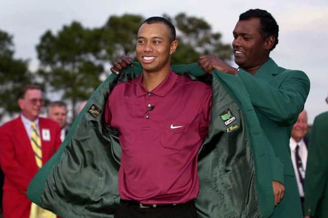 Tiger Woods is presented with his second green jacket at Augusta in 2001. Picture: Harry How/Allsport