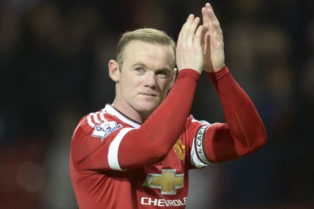 Wayne Rooney applauds to acknowledge the crowd after the final whistle. Picture: AFP/Getty