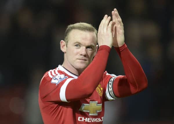 Wayne Rooney applauds to acknowledge the crowd after the final whistle. Picture: AFP/Getty