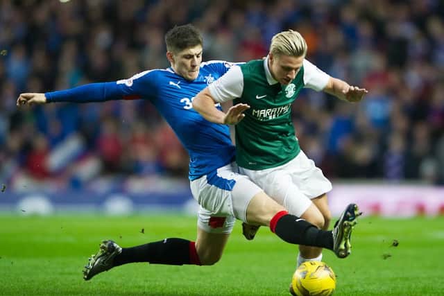 Rangers' Rob Kiernan challenges Jason Cummings, who was one of Hibernian's better performers on the day. Picture: John Devlin