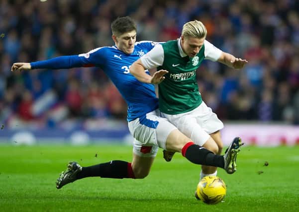 Rangers' Rob Kiernan challenges Jason Cummings, who was one of Hibernian's better performers on the day. Picture: John Devlin