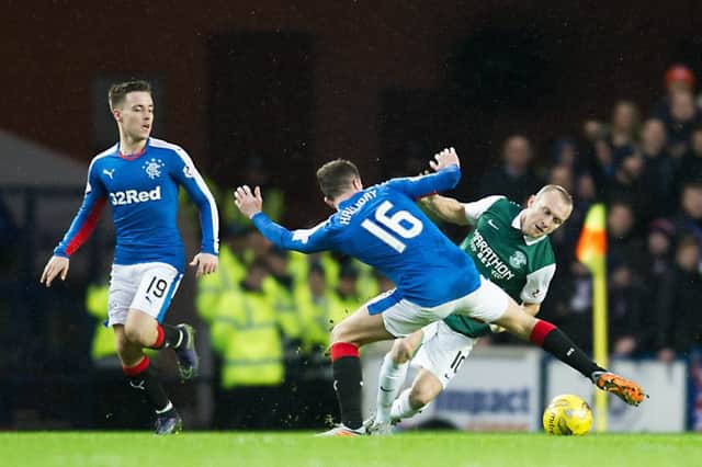 Rangers' Andy Halliday jostles for possession with Dylan McGeouch of Hibs. Picture: John Devlin